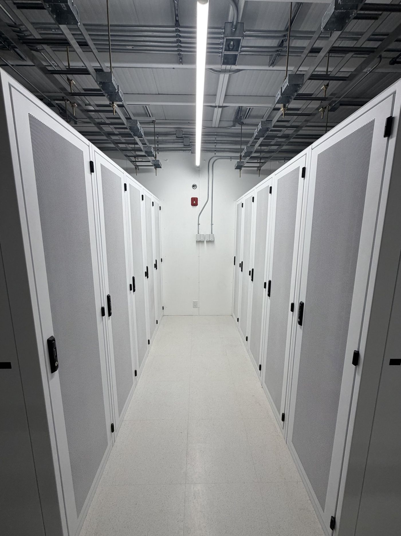 Cabinet aisle with overhead cable management