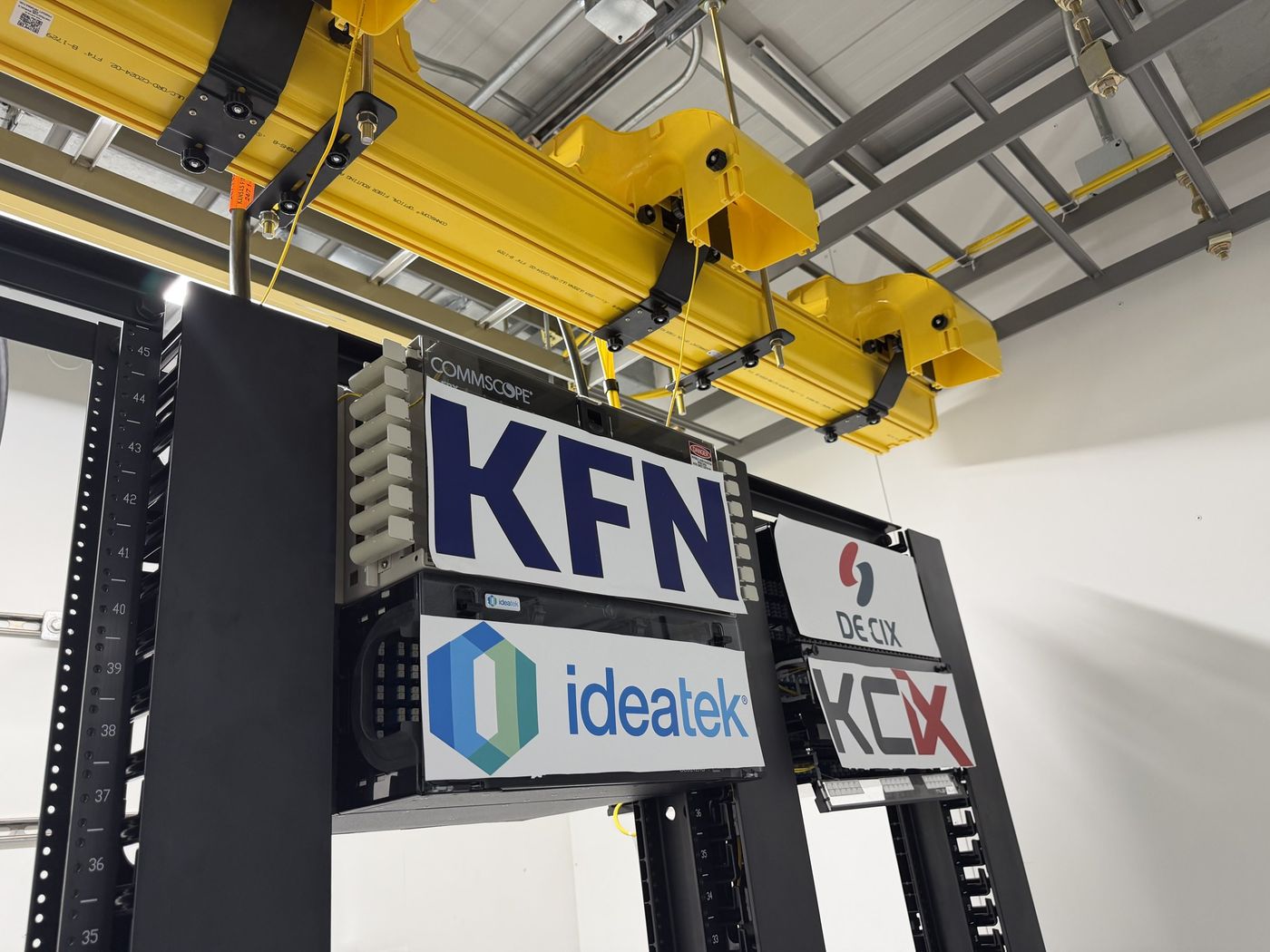 Network racks labeled for local carriers and the exchanges
